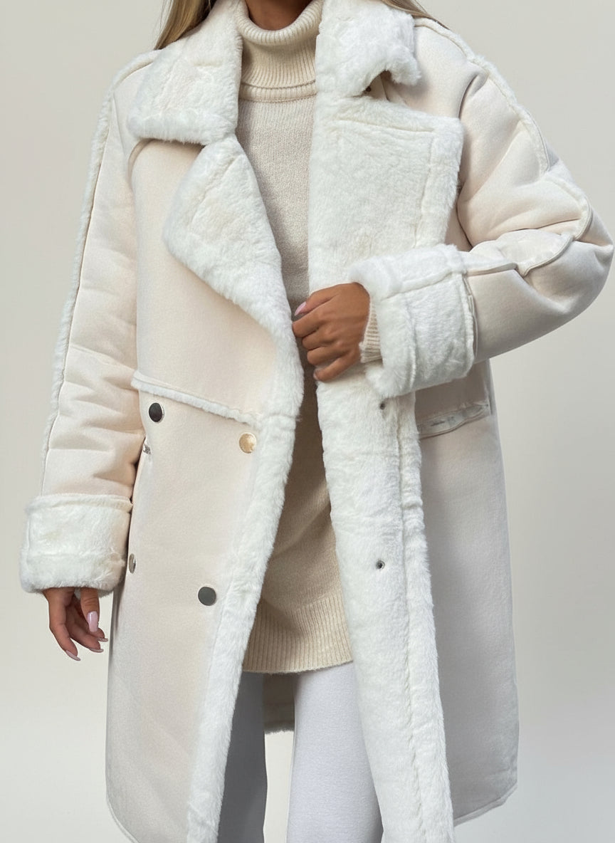 Person wearing a white coat with fur trim in an urban setting