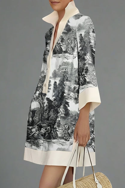 Person wearing a black and white patterned dress with a plain background
